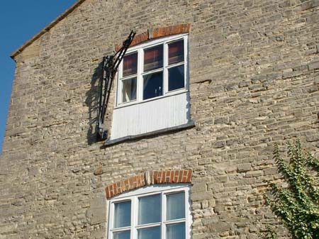 The Captains, detail of the crane attached to the south gable wall.