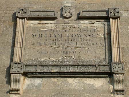Townsend's Almshouses, Newland - the inscription in the centre of the facade.