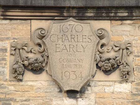 Plaque outside Witney Mill, 1934. It reads, '1670 CHARLES EARLY AND COMPANY LIMITED 1934'.
